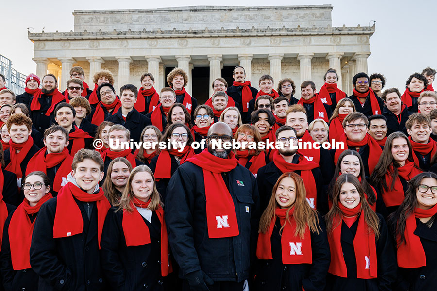 Chancellor Rodney Bennett takes a photo with members of the UNL Choir outside the Lincoln Memorial. 