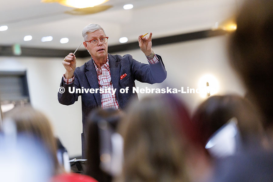 Peter Eklund, Professor in the Glenn Korff School of Music, conducts the UNL choir during rehearsal 