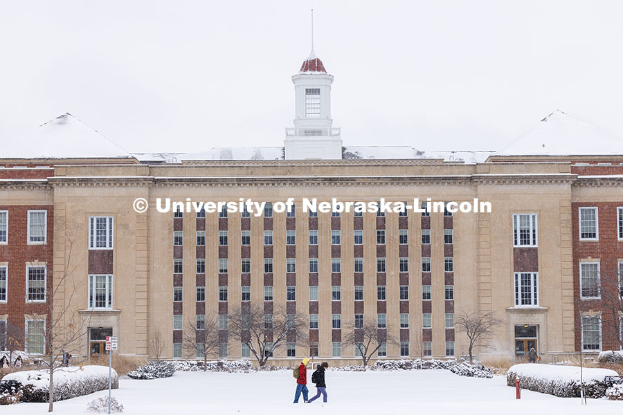 Students crossing UNL’s snow-covered campus on the south side of Love Library. Snow on City Campus