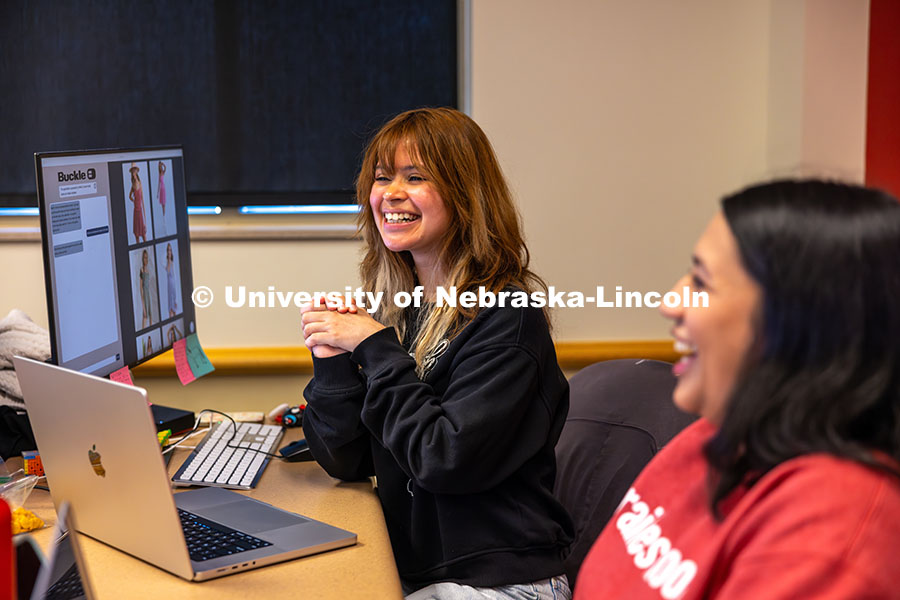 Katia Henrriquez smiles as her and the Design Studio team work on their AI program for Nebraska-base