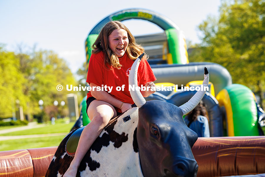 250503_End of Year Bash_389.jpg Amanda Courtney, a junior music education major, rides the mechanical bull at the End of Year Bash o