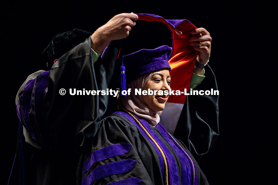 250503_Law_Commencement_0546.jpg Fatima Al-Haidari receives her hood at the 2025 College of Law commencement in the Lied Center. May