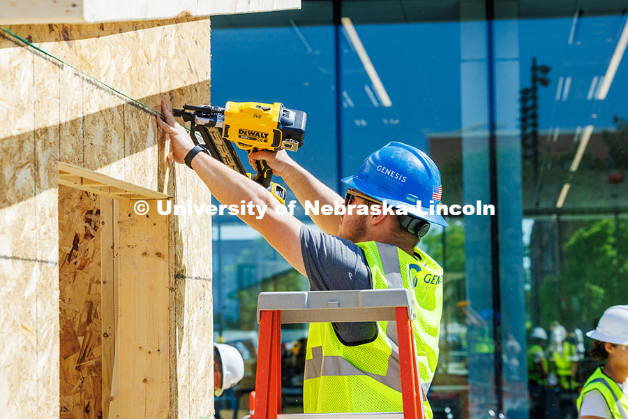 250508_Const_Mgmt_303.jpg Eaden Holt, a junior Construction Management major, uses a nail gun while working on the frame of th