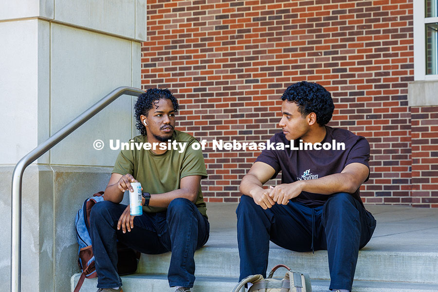 250509_Big_Red_Finale_086.jpg (Left) Senior, Mohamed Elimam, and Junior, Sayid Alsayid, sit outside the City Campus Union having a