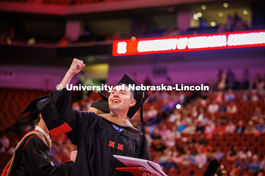 250516_Grad_Commencement_1158.jpg Accountancy graduate student, Connor Morrissey, fist pumps the air on his way out of the Graduate Co