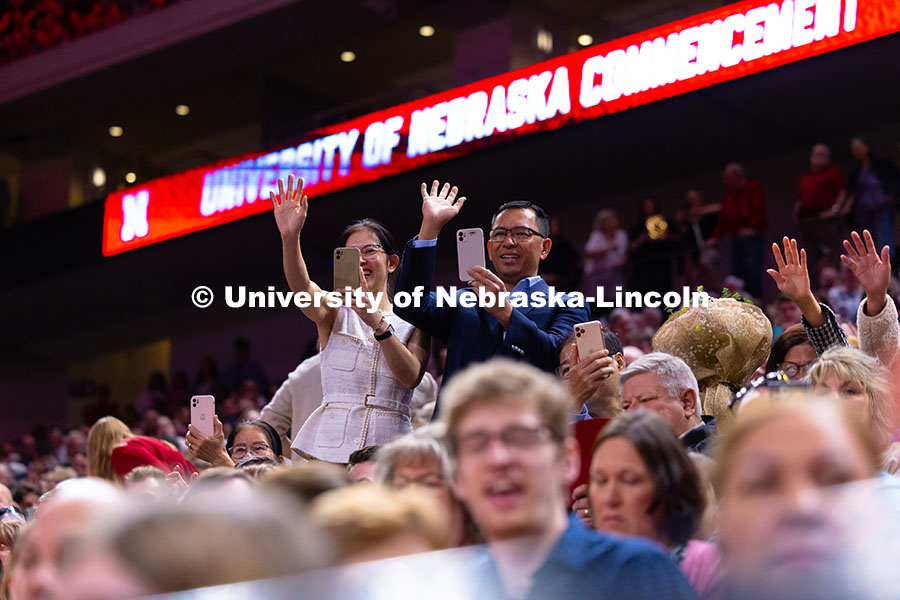 250517_Commencement_1600.jpg Family members cheer and record video of their student in Pinnacle Bank Arena during the processiona
