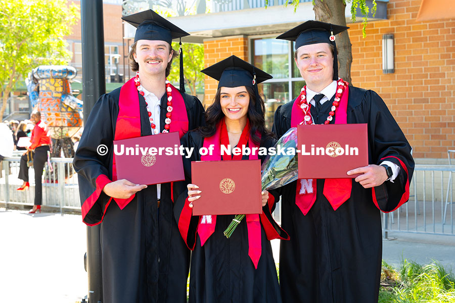250517_Commencement_1892.jpg Triplets Josh, Paige and Drew Ferguson pose with their diplomas outside of Pinnacle Bank Arena after