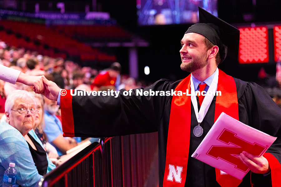 250517_Commencement_2390.jpg Kalon Rohde reaches out to shake hands with Nick Wright, the brother of Rohde's close friend and fel