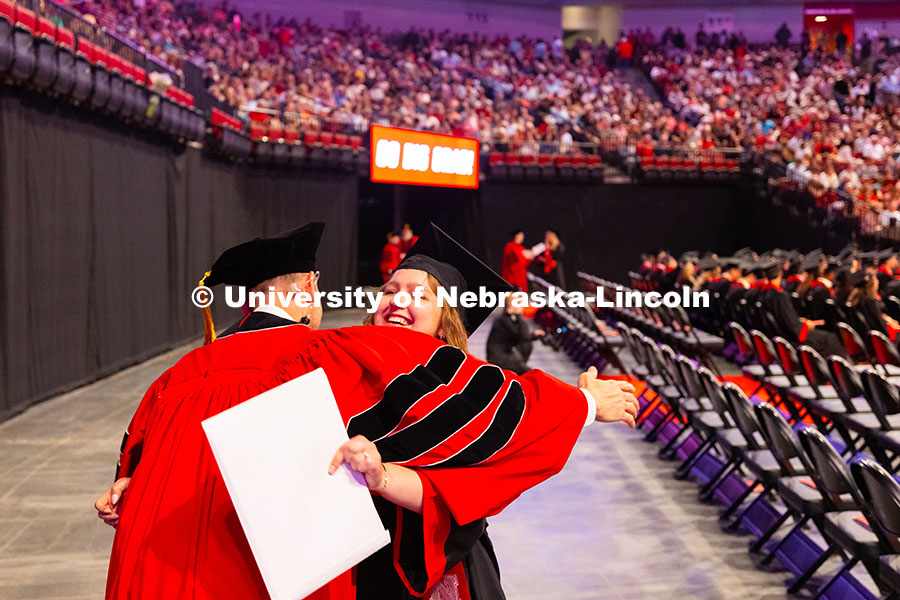 250517_Commencement_7942.jpg Kenneth Pyle gives a hug to graduate Clara Walstad, who was one of his advisees in the Fisheries and