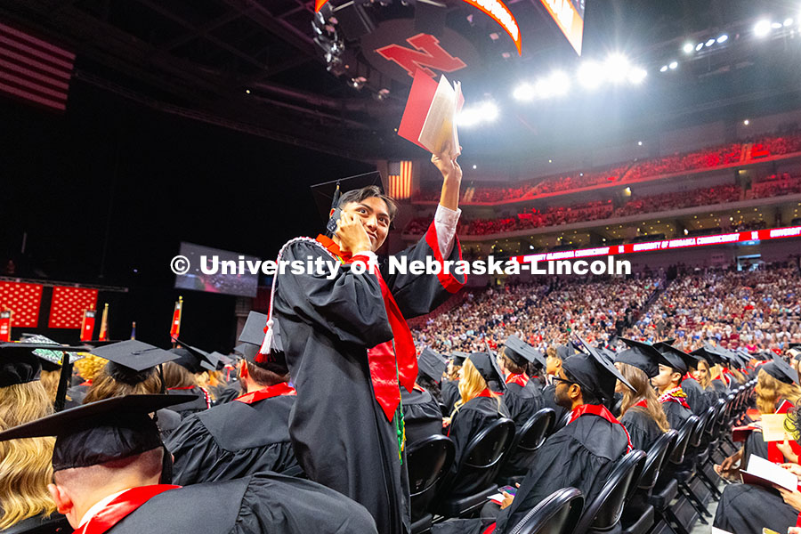 250517_Commencement_8319.jpg Carlos Tavira-Villegas waves to his family, who were seated not far from him during the afternoon co