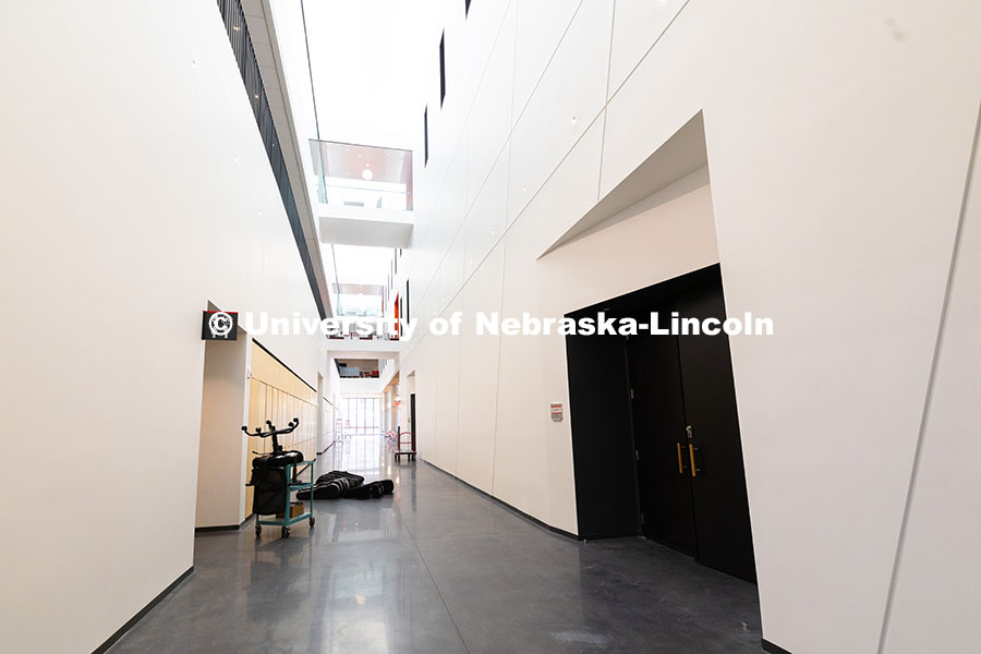 250522_FPA_8608.jpg String instruments are placed outside of a line of light wood lockers on the first floor of the new