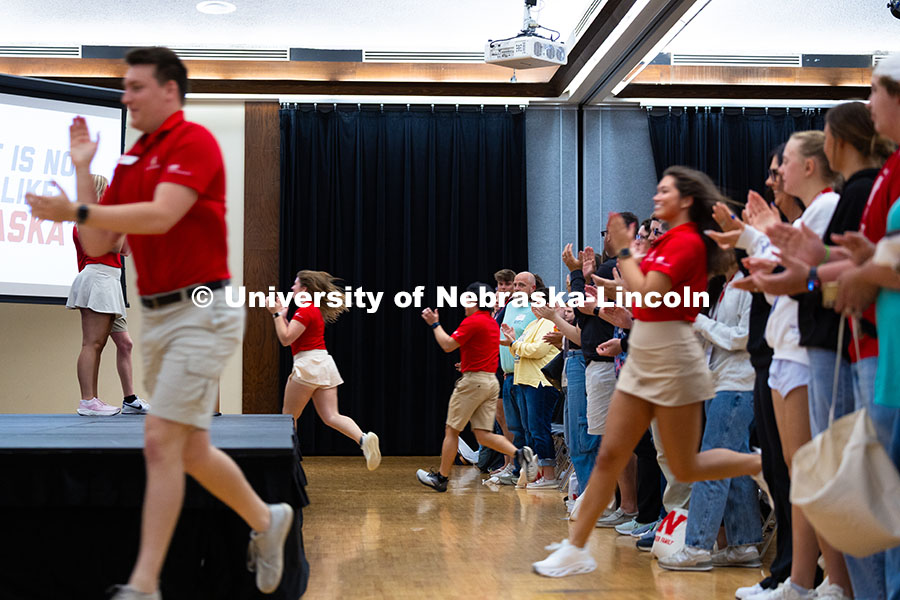 250529_NSE_9251.jpg New Student Enrollment leaders run through the crowd of new students and their parents and guardians