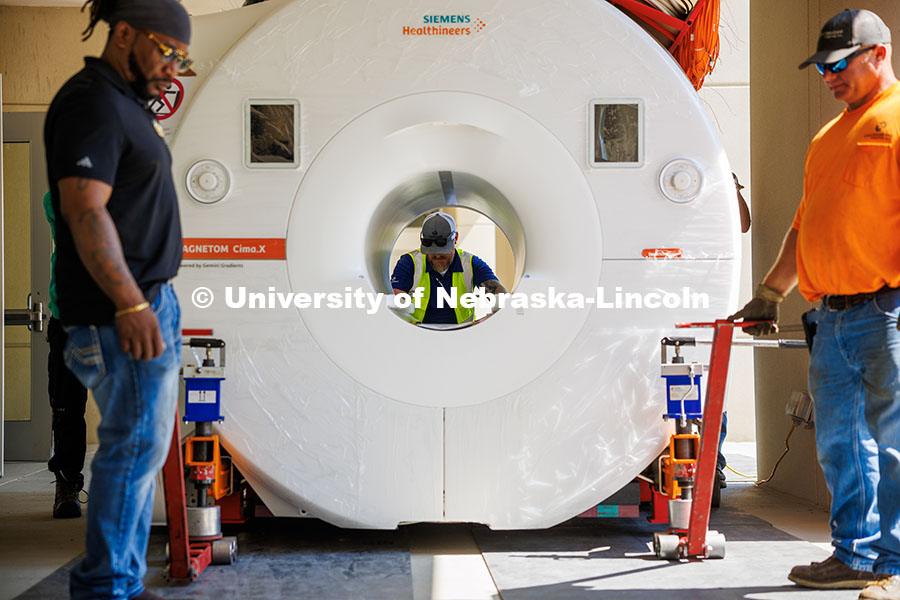 250610_MRI_Installation_275.jpg Jay Daniels from Cassling pushes the MRI scanner closer to the room where it will be installed in Me