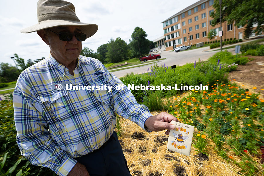 250614_Discovery_Days_358.jpg John Carrioto, a volunteer with the Nebraska Extension Master Gardener program, holds a pollinator f