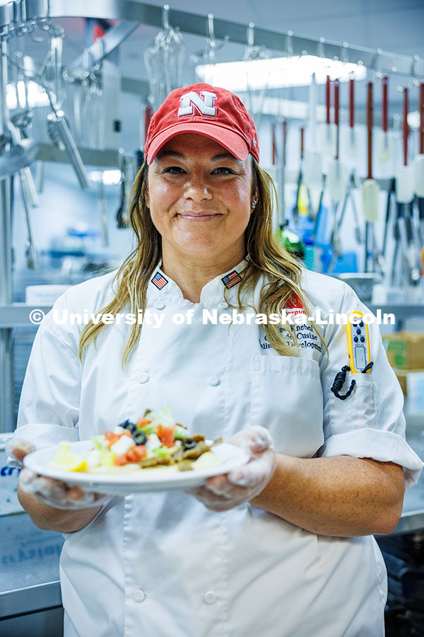 Paige Knebel poses in the Willa Cather Dining Hall. Knebel is the ‘Chef de Cuisine’ for UNL. Her