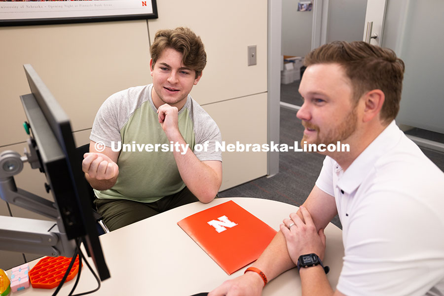 250624_Navigators_0985.jpg Adam Christiansen, Academic Navigator in the Explore Center, speaks with Jacob Behnk, a senior study