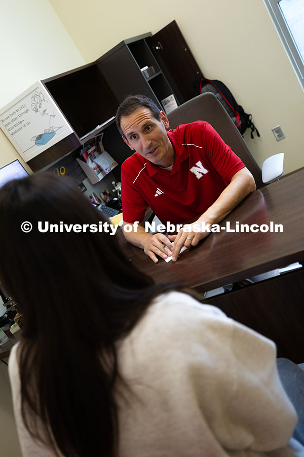 250624_Navigators_1293.jpg Parker Reed speaks with Mireu Ryu, a senior studying computer science, in his office in Hawks Hall.