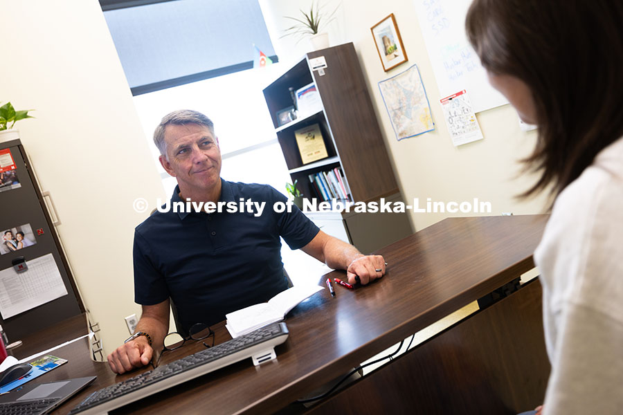 250624_Navigators_1396.jpg Dave Nebel speaks with Mireu Ryu, a senior studying computer science, in his office in Hawks Hall. N
