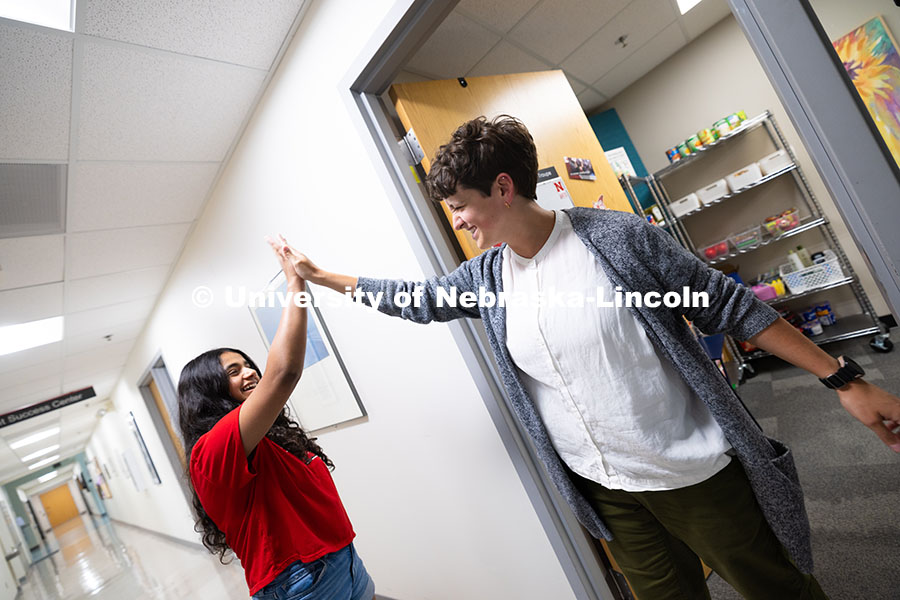 Sara Troupe gives a high-five to Nyssa Fernandez, a sophomore studying Film, Emerging Media Arts and