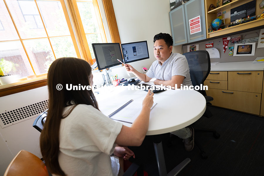Donny Bui, an academic success coach in the Center for Academic Success and Transition, meets with K