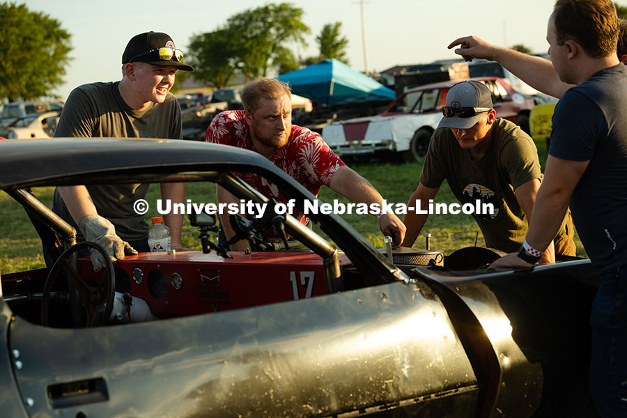 Members of the UNL Figure 8 Racing Team troubleshoot in the parking lot south of the Polk County Fai