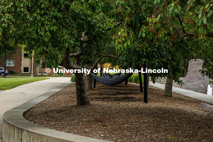Hammocks sit empty by the Nebraska Union plaza. Summer on City Campus. July 16, 2025. 