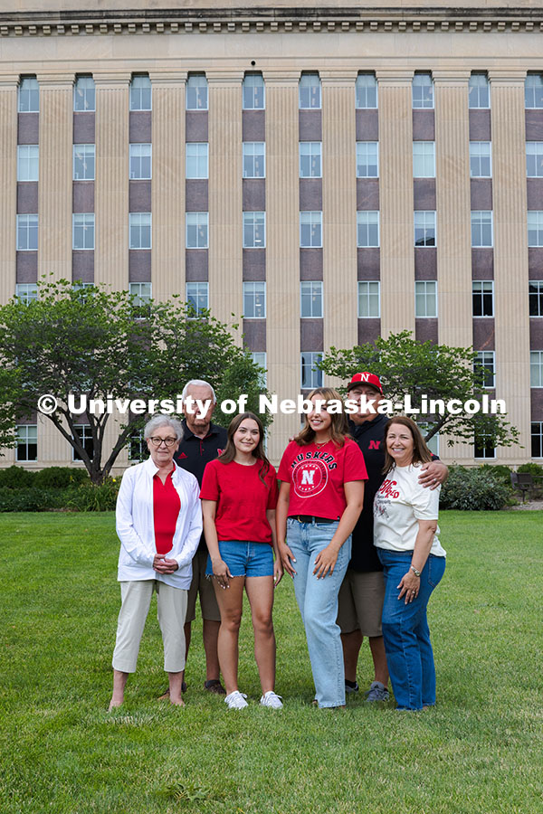 250716_PSA_Haring_2891.jpg Sisters Madison and Lauren Haring pose with their family in front of Love Library. The Haring family