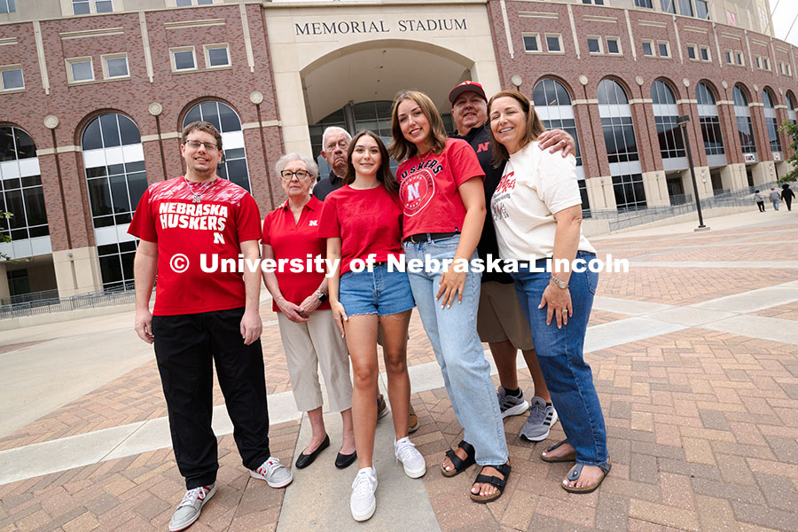 250716_PSA_Haring_3087.jpg Sisters Madison and Lauren Haring pose with their family, plus Kevin Coleman, outside of Memorial St
