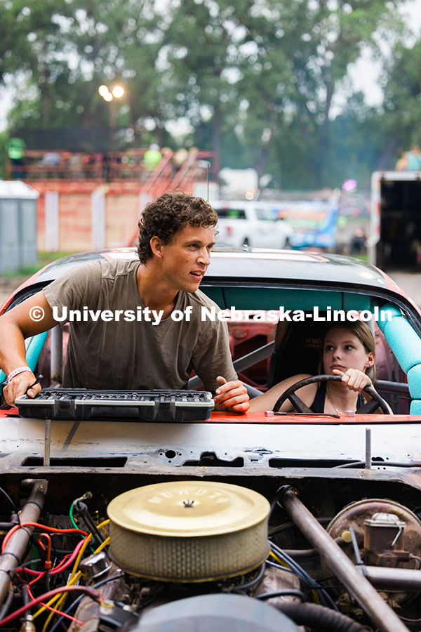 250717_Engineering_8170.jpg Jack Norris, and Anna Hadan, mechanical engineer majors, work on the UNL Figure 8 Racecar between ra