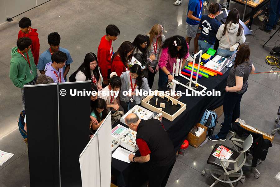 250523_Science_Olympiad_8961.jpg Students gather at the Ward's Science exhibit during the Science Olympiad National Tournament STEM E