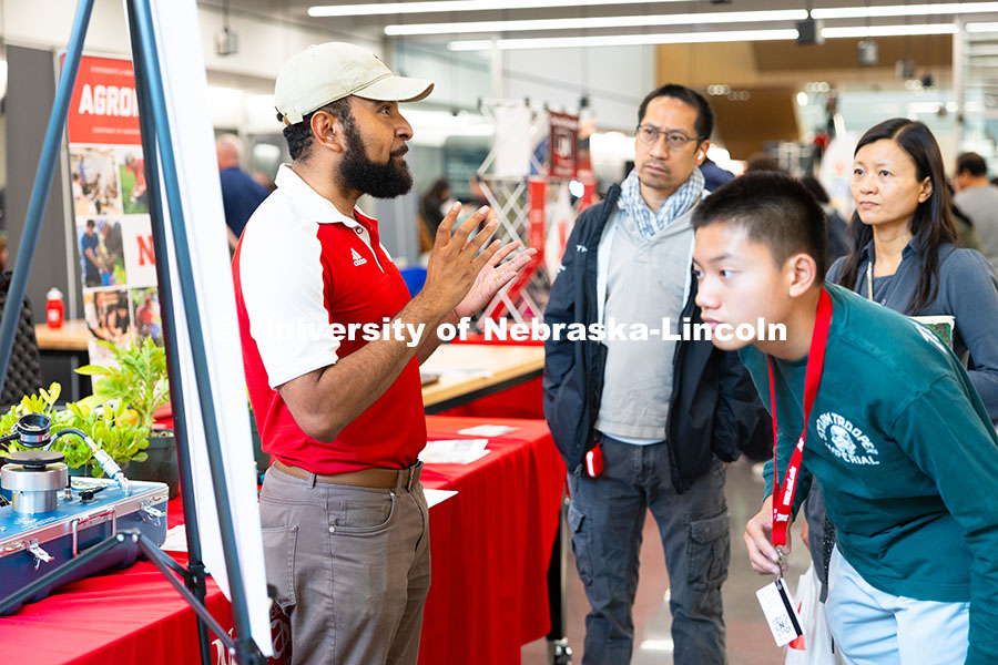 250523_Science_Olympiad_9016.jpg Aldi Airori, research technologist in the department of agronomy and horticulture, speaks with Natha