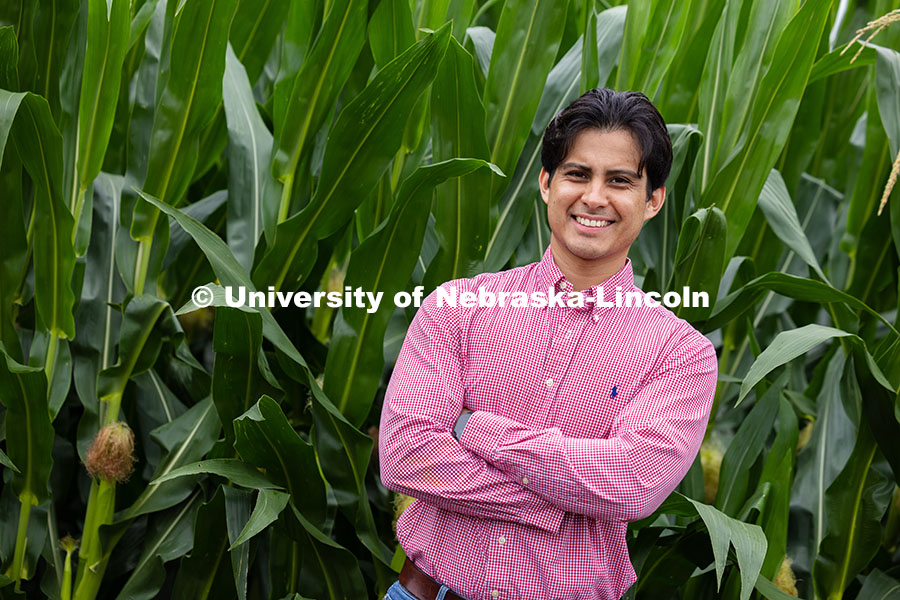 Vladimir Torres-Rodriguez, a research assistant professor in agronomy and horticulture, poses by hyb
