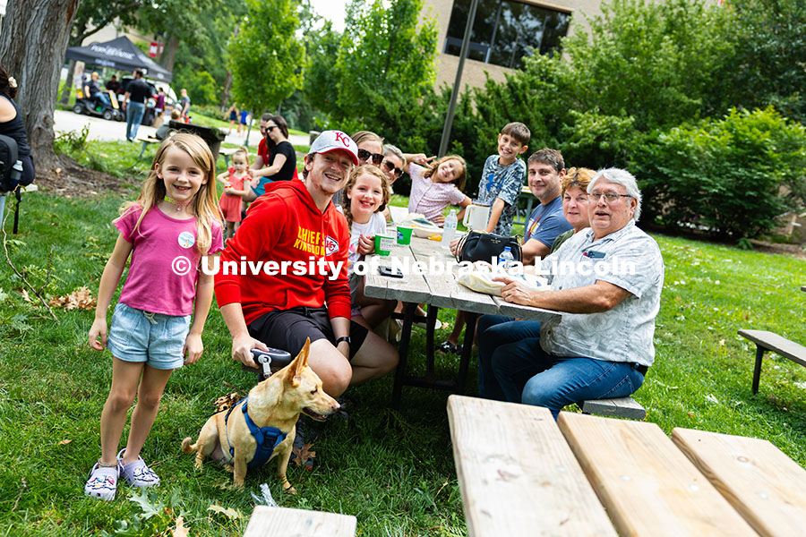 The Olguin family and their neighbors, the Lindholls, enjoy lunch on East Campus during Discovery Da
