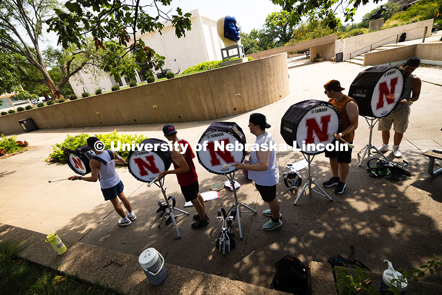 250815_Band_3548.jpg The Cornhusker Marching Band percussionists practice in the shade during Marching Band camp. August