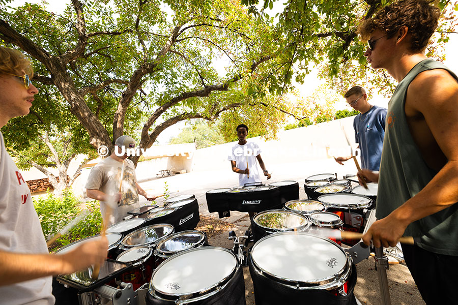 250815_Band_3585.jpg The Cornhusker Marching Band percussionists practice in the shade during Marching Band camp. August