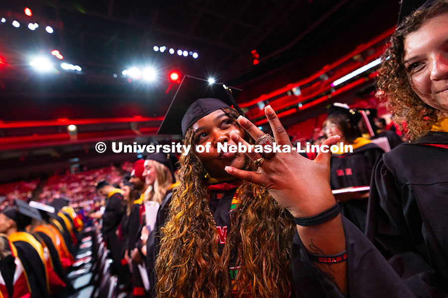 Amara Smith Speights holds out her ring. Smith Speights was part of the championship-winning Husker 