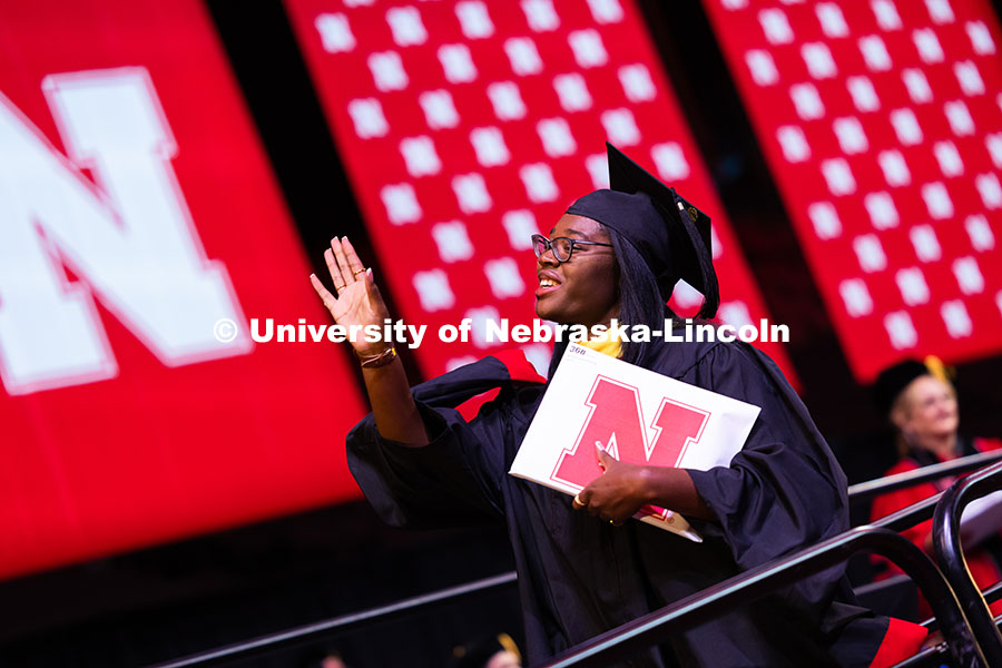 250816_Commencement_3734.jpg Ma'Kiya Carter waves to a friend after receiving her diploma at the summer commencement ceremony. Su