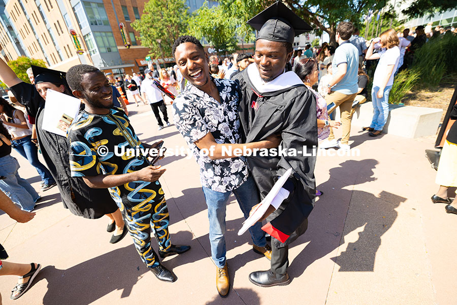 Oluseye Fakinlede is hugged by his brother after meeting up outside of Pinnacle Bank Arena. Fakinled