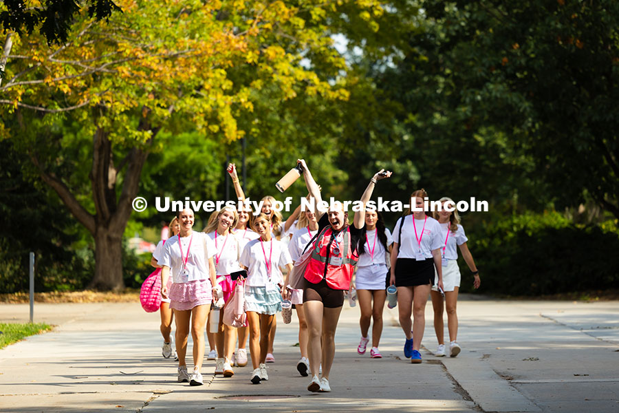 Sorority recruits walk across campus near the Nebraska Union. Sorority Rush Week. August 18, 2025. 