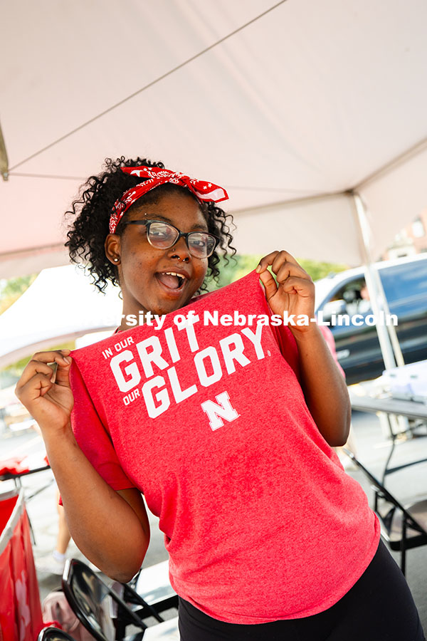 Maya Evans, a junior and residence hall desk assistant, poses while working move-in. Residence hall 