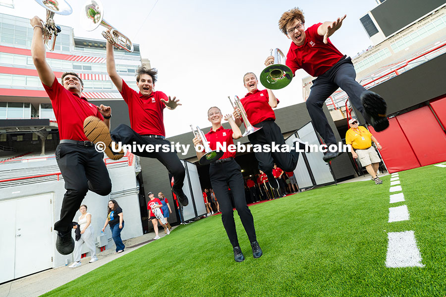 Mellophone players Parker McIlnay, Brennan Clark, Lily Gliske, Faith Rinaldi and Hudson Carrico jump