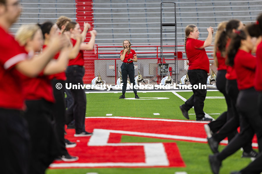 Gretchen Muth, one of the drum majors and a senior, calls instructions during the drill-down – a c