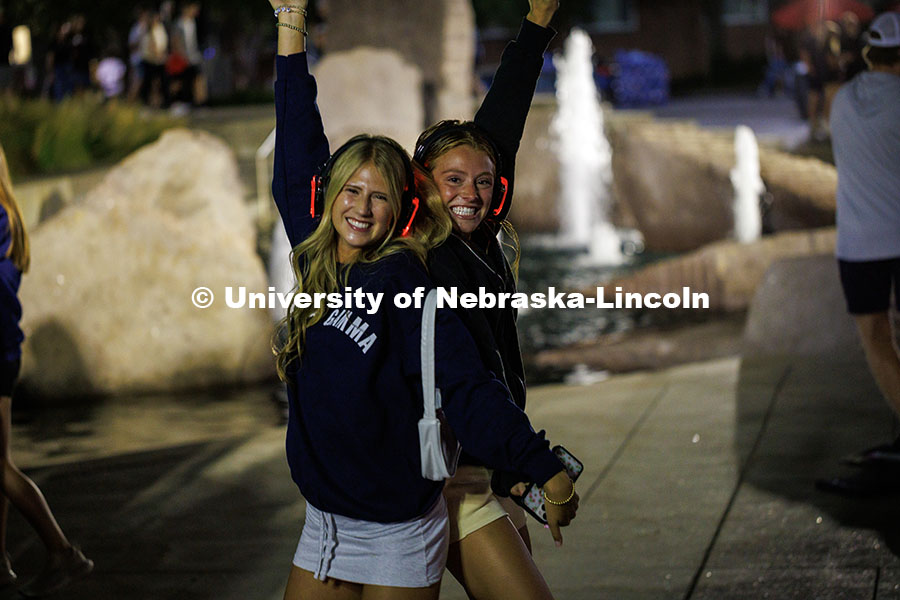 Delta Gamma sisters dance at the Silent Disco section during the Big Red Welcome Party at the Union.