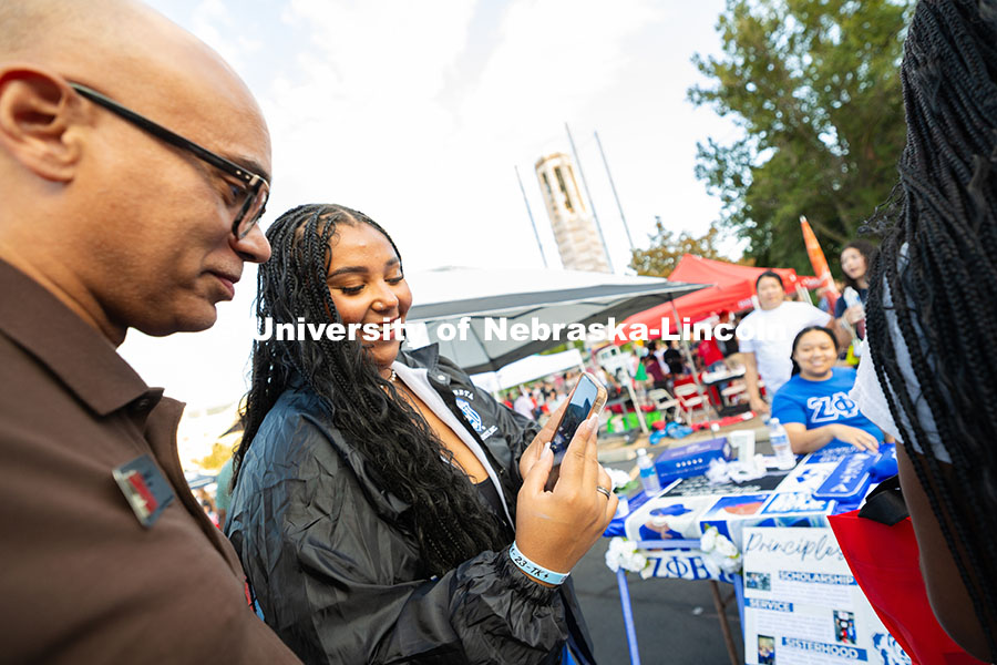 Lilly Brown, chapter president of the Zeta Phi Beta sorority, shows T.J. McDowell, Assistant Vice Ch