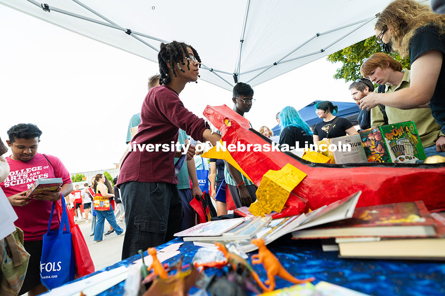 Tayven Washington, a first-year student studying software engineering, sticks his hand into the mout