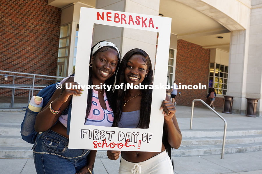 Nya Tuach (left) and Awien Riing pose for their first day of school photo in front of the Nebraska U