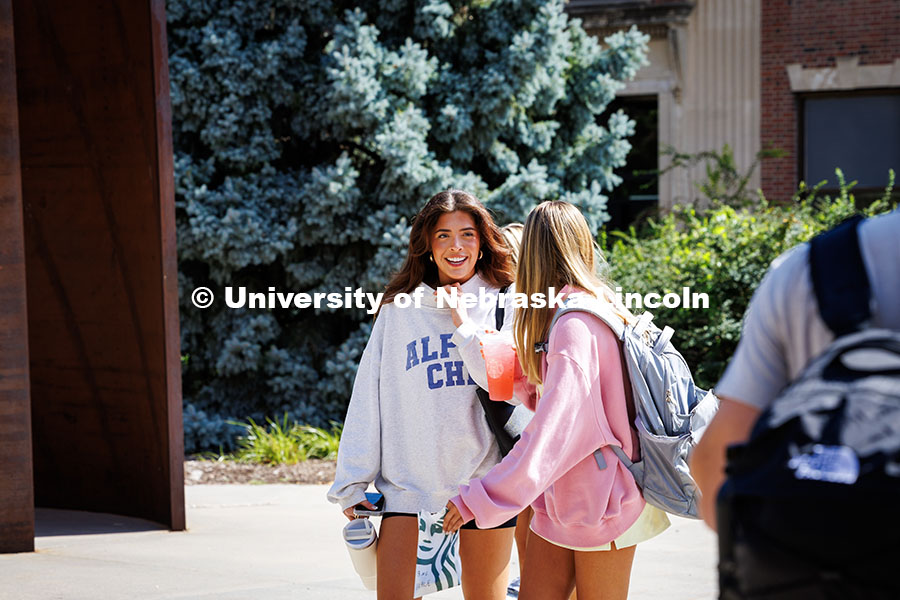 Avery Ellis (left) and Grace Mueller walk to class on the first day of classes, fall semester. Augus