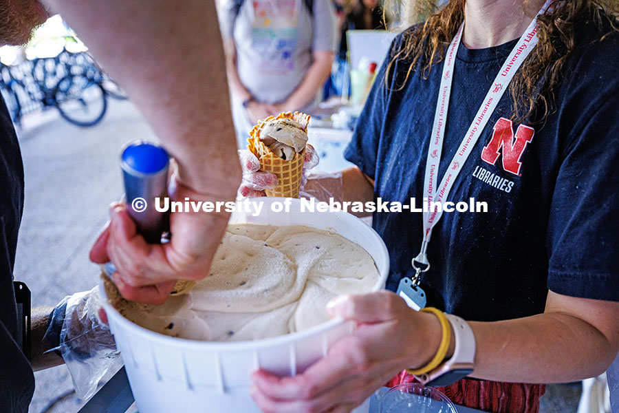 UNL Library staff scoop ice cream for the celebration of the Pages to Paths initiative held by UNL L