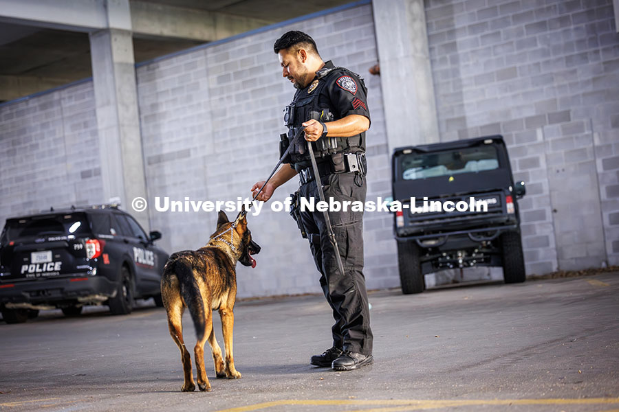 Dodger, the newest bomb-sniffing dog for UNLPD, and Officer Anderson Delgado practice finding a hidd