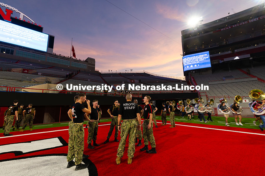 NROTC members chat after running 2,071 stairs for the 9/11 stair climb in Memorial Stadium in commem